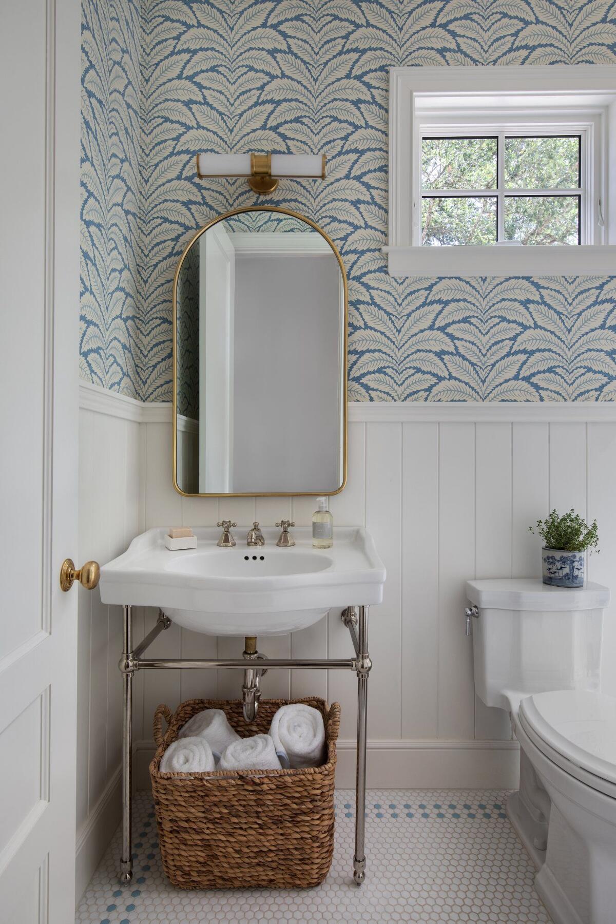 Powder bath with blue wallpaper